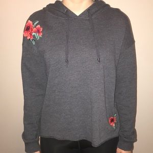 A dark gray floral hoodie.